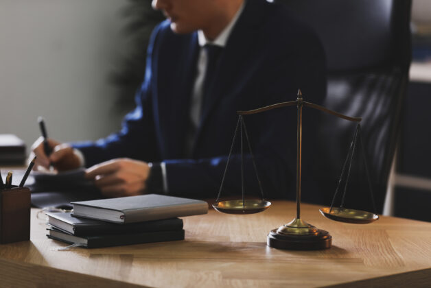 Male,Lawyer,Working,At,Table,In,Office,,Focus,On,Scales Male,Lawyer,Working,At,Table,In,Office,,Focus,On,Scales